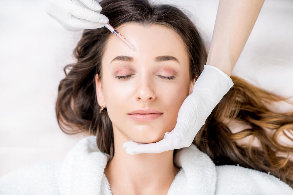 Woman receiving BOTOX treatment