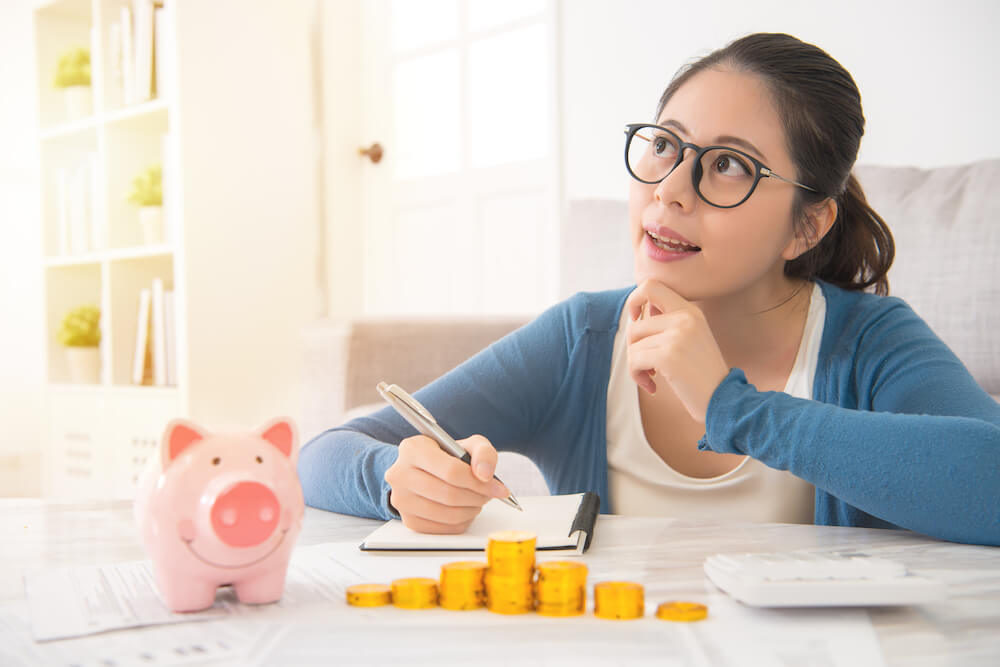 Asian woman looking over finances